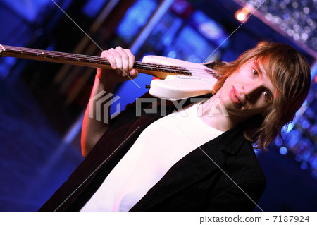 Young guitar player performing in night club Young guitar player performing in night club 7187924