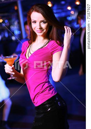 Young woman having fun at nightclub disco 7187927