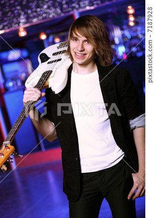 Young guitar player performing in night club Young guitar player performing in night club 7187928