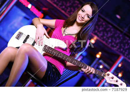 Young guitar player performing in night club Young guitar player performing in night club 7187929
