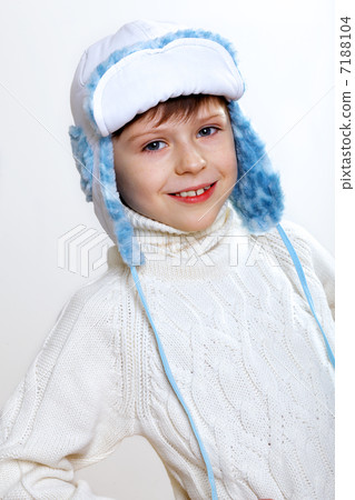 Kid in winter wear against white background 7188104