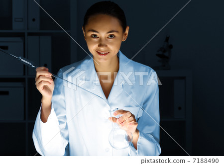 Young chemist working in laboratory Young chemist working in laboratory 7188490
