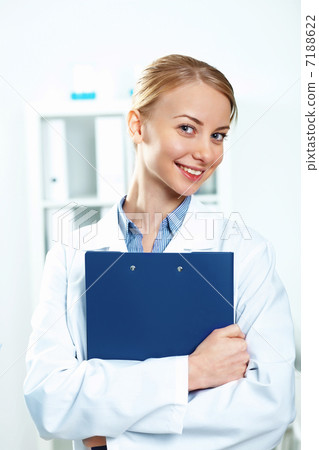 Young doctor in white uniform Young doctor in white uniform 7188622