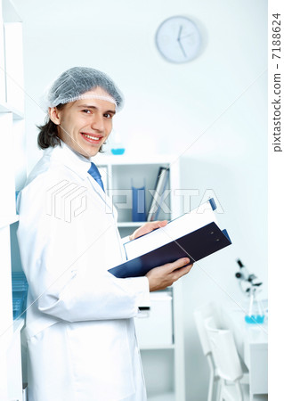 Young doctor in white uniform 7188624