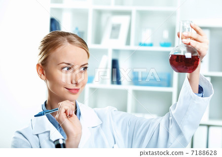 Young scientist working in laboratory Young scientist working in laboratory 7188628