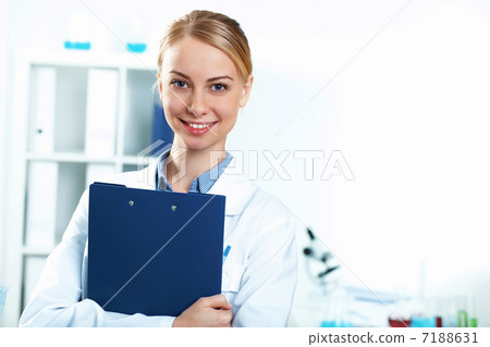 Young doctor in white uniform Young doctor in white uniform 7188631
