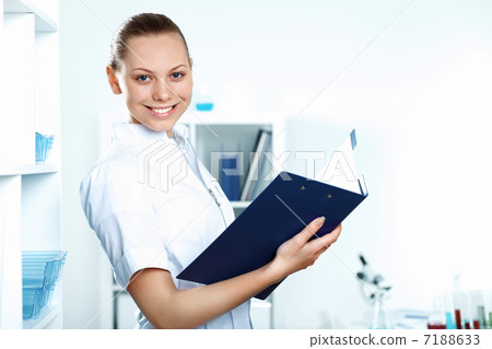 Young doctor in white uniform 7188633