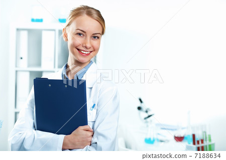 Young doctor in white uniform Young doctor in white uniform 7188634
