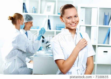 Young scientists working in laboratory Young scientists working in laboratory 7188635