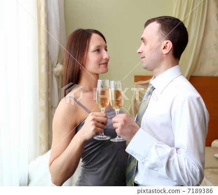 young couple with glasses of champagne 7189386