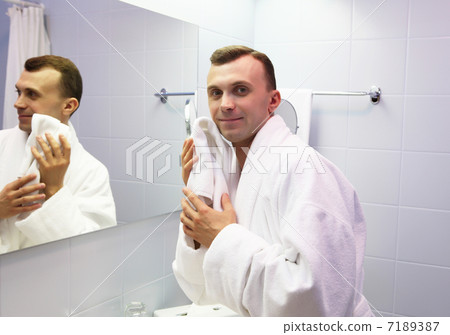 young man in bathroom young man in bathroom 7189387