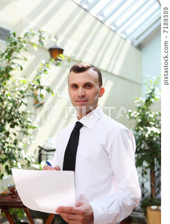 young businessman in the garden young businessman in the garden 7189389