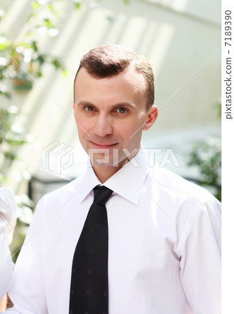 young businessman in the garden young businessman in the garden 7189390