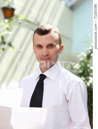 young businessman in the garden young businessman in the garden 7189396