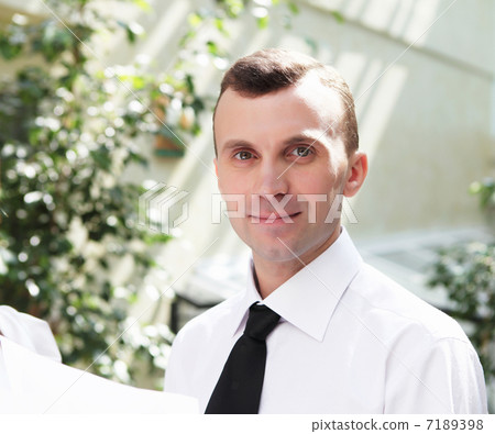 young businessman in the garden young businessman in the garden 7189398