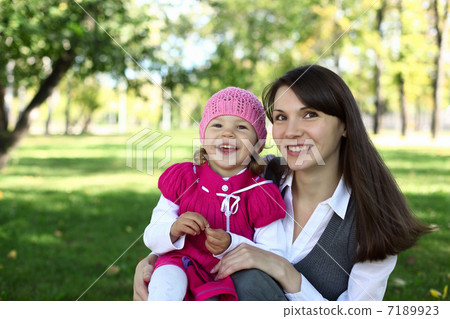 Mother with her daughter in summer park Mother with her daughter in summer park 7189923