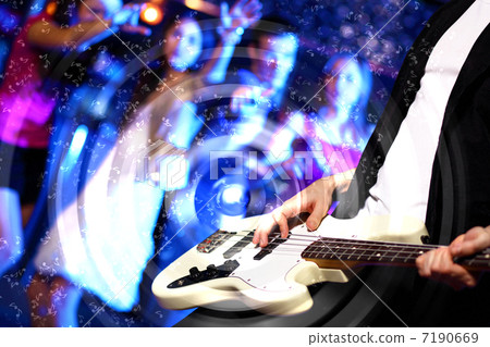 Young guitar player performing in night club 7190669