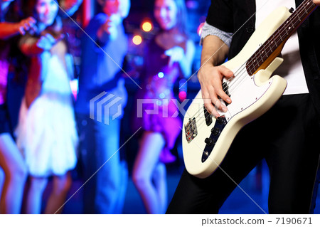 Young guitar player performing in night club Young guitar player performing in night club 7190671