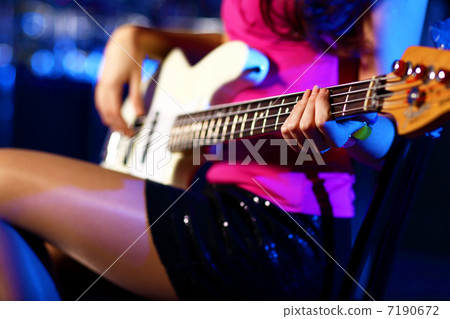 Young guitar player performing in night club Young guitar player performing in night club 7190672