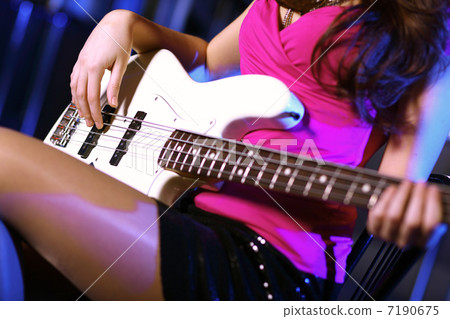 Young guitar player performing in night club Young guitar player performing in night club 7190675