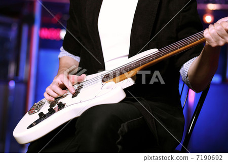 Young guitar player performing in night club Young guitar player performing in night club 7190692