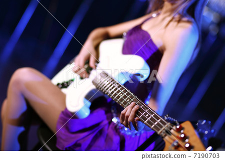 Young guitar player performing in night club Young guitar player performing in night club 7190703