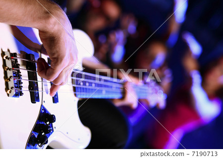 Young guitar player performing in night club Young guitar player performing in night club 7190713