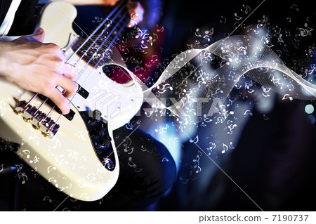 Young guitar player performing in night club 7190737