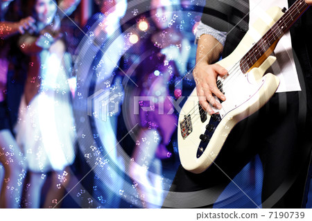 Young guitar player performing in night club 7190739