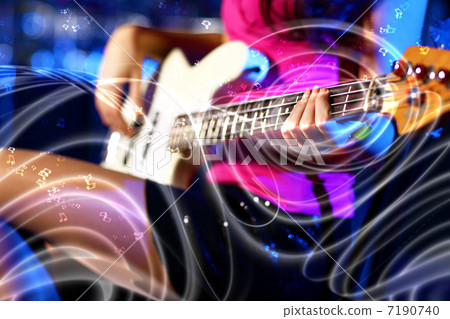 Young guitar player performing in night club 7190740