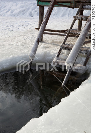 Staircase and a ice hole for the winter swimming at the river. 7195763