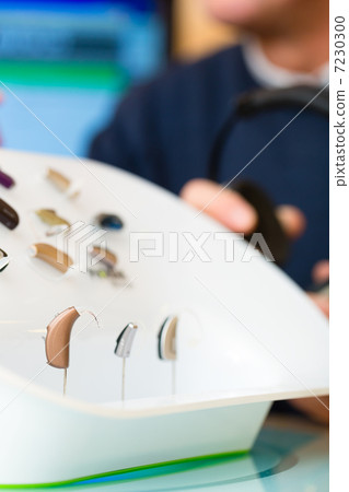 Hearing aid on a presentation table Hearing aid on a presentation table 7230300