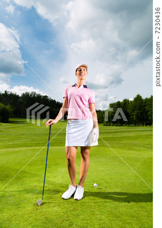 Young female golf player on course Young female golf player on course 7230436
