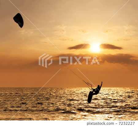 Kite surfer jumping from the water 7232227
