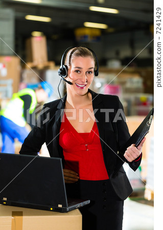 dispatcher using headset at warehouse of forwarding dispatcher using headset at warehouse of forwarding 7241429