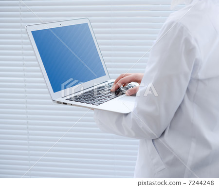 Doctor with laptop Doctor with laptop 7244248