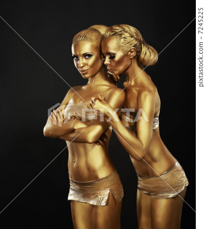 Bodyart. Girlfriends with Golden Makeup in Embrace. Art Deco Bodyart. Girlfriends with Golden Makeup in Embrace. Art Deco 7245225