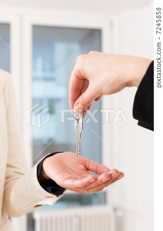 Young realtor is with keys in an apartment 7245858