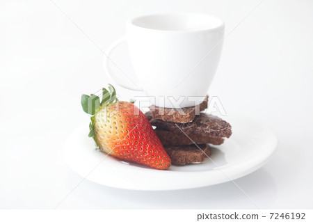 white cup with saucer, chocolate and strawberry 7246192
