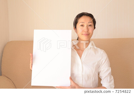 A woman with a message board 7254822