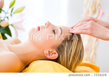 Wellness - woman getting head massage in Spa 7258329