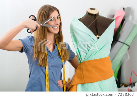 Fashion designer or tailor working in studio 7258363