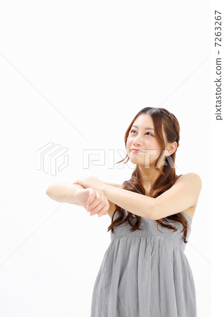 Girls touching their lower arms Girls touching their lower arms 7263267