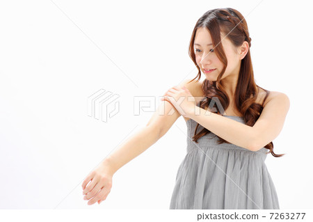 Girls touching their lower arms Girls touching their lower arms 7263277