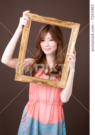 A woman with a picture frame A woman with a picture frame 7263965