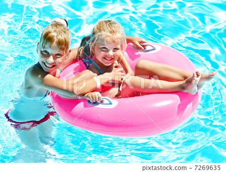 Children sitting on inflatable ring. Children sitting on inflatable ring. 7269635