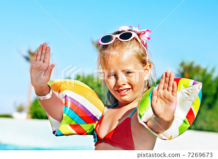Child   near swimming pool. 7269673