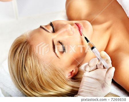 Doctor woman giving botox injections. Doctor woman giving botox injections. 7269838