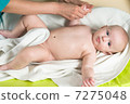 doctor massaging baby 7275048