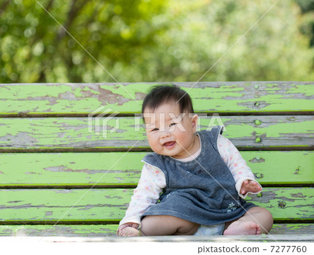 A cute baby in the park 7277760
